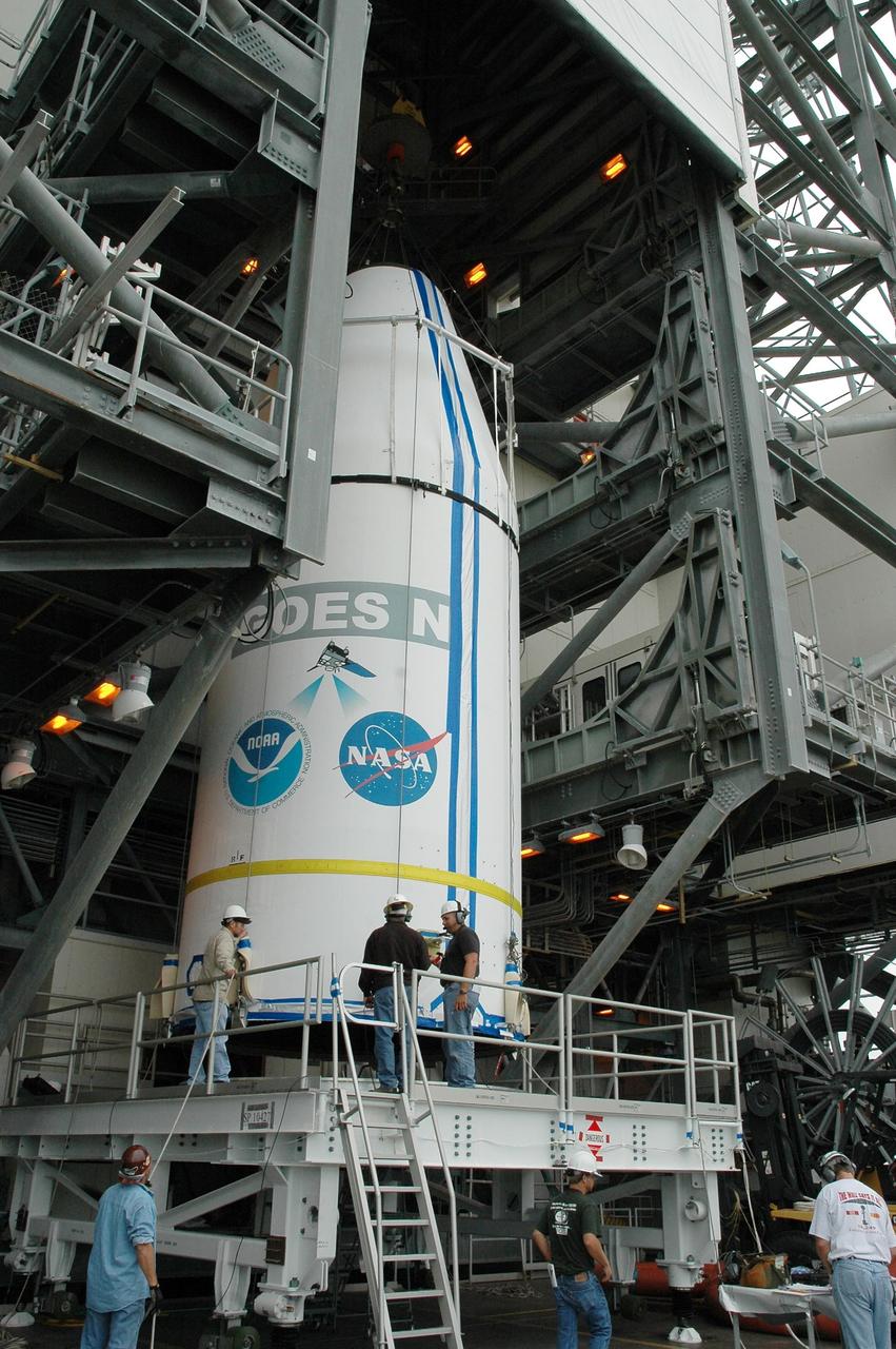 KENNEDY SPACE CENTER, FLA. - On Launch Complex 37 at Cape Canaveral Air Force Station in Florida, the GOES-N spacecraft is lifted off its transporter into the mobile service tower. There it will be mated with the second stage of the Boeing Delta IV rocket. GOES-N is the latest in a series of Geostationary Operational Environmental Satellites for NOAA and NASA, providing continuous monitoring necessary for intensive data analysis. GOES-N is scheduled to be launched May 18 in an hour-long window between 6:14 and 7:14 p.m. EDT. Photo credit: NASA/Charisse Nahser