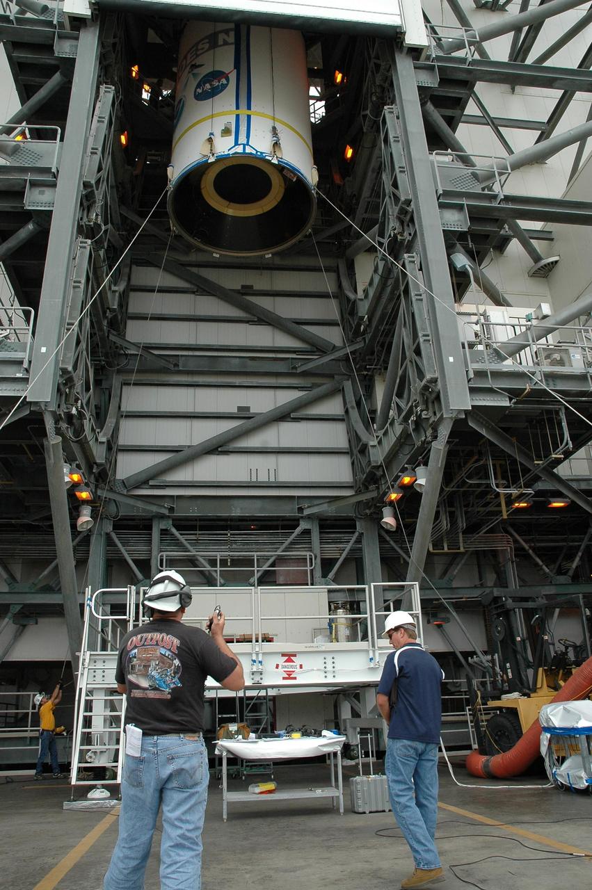 KENNEDY SPACE CENTER, FLA. - On Launch Complex 37 at Cape Canaveral Air Force Station in Florida, the GOES-N spacecraft disappears into the upper levels of the mobile service tower. There it will be mated with the second stage of the Boeing Delta IV rocket. GOES-N is the latest in a series of Geostationary Operational Environmental Satellites for NOAA and NASA, providing continuous monitoring necessary for intensive data analysis. GOES-N is scheduled to be launched May 18 in an hour-long window between 6:14 and 7:14 p.m. EDT. Photo credit: NASA/Charisse Nahser