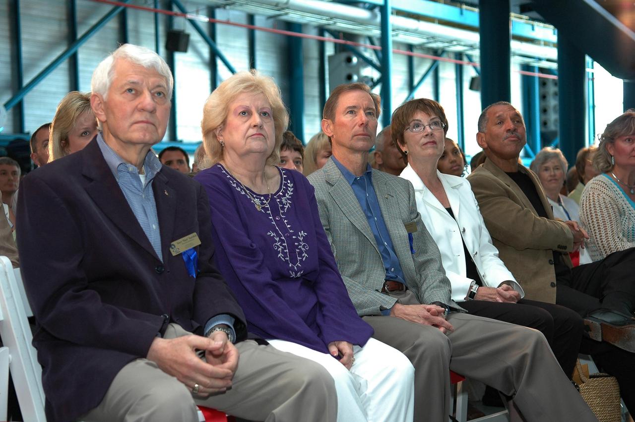 KENNEDY SPACE CENTER, FLA. - Henry "Hank" Hartsfield Jr. (left), Brewster H. Shaw Jr. (third from left) and Charles F. Bolden Jr. (fifth from left), along with family members, listen to opening remarks at the U. S. Astronaut Hall of Fame induction ceremony held in the Apollo/Saturn V Center. Hartsfield, Shaw and Bolden, all former NASA astronauts, are the inductees for 2006. The U.S. Astronaut Hall of Fame now includes 63 space explorers. Photo credit: NASA/Kim Shiflett