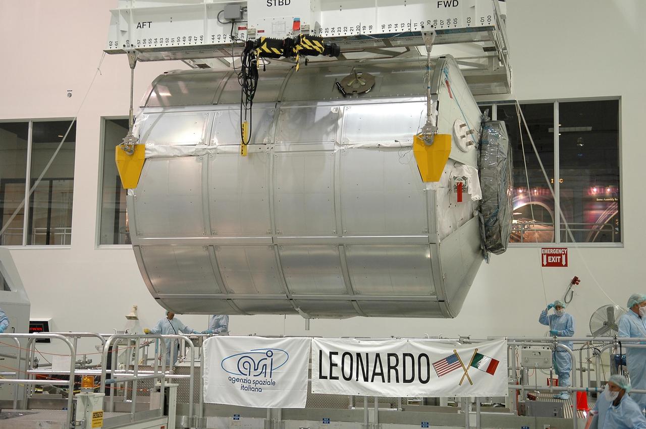 KENNEDY SPACE CENTER, FLA. - In the Space Station Processing Facility, the multi-purpose logistics module Leonardo is lifted by crane off a workstand. The module is being moved to the payload transportation canister for transfer to Launch Pad 39B, where it will be installed in Space Shuttle Discovery's payload bay. Part of the payload for mission STS-121, Leonardo carries tons of supplies and experiments for the International Space Station and its crew. Discovery is scheduled to be launched in a window that extends from July 1 to July 19. Photo credit: NASA/Kim Shiflett