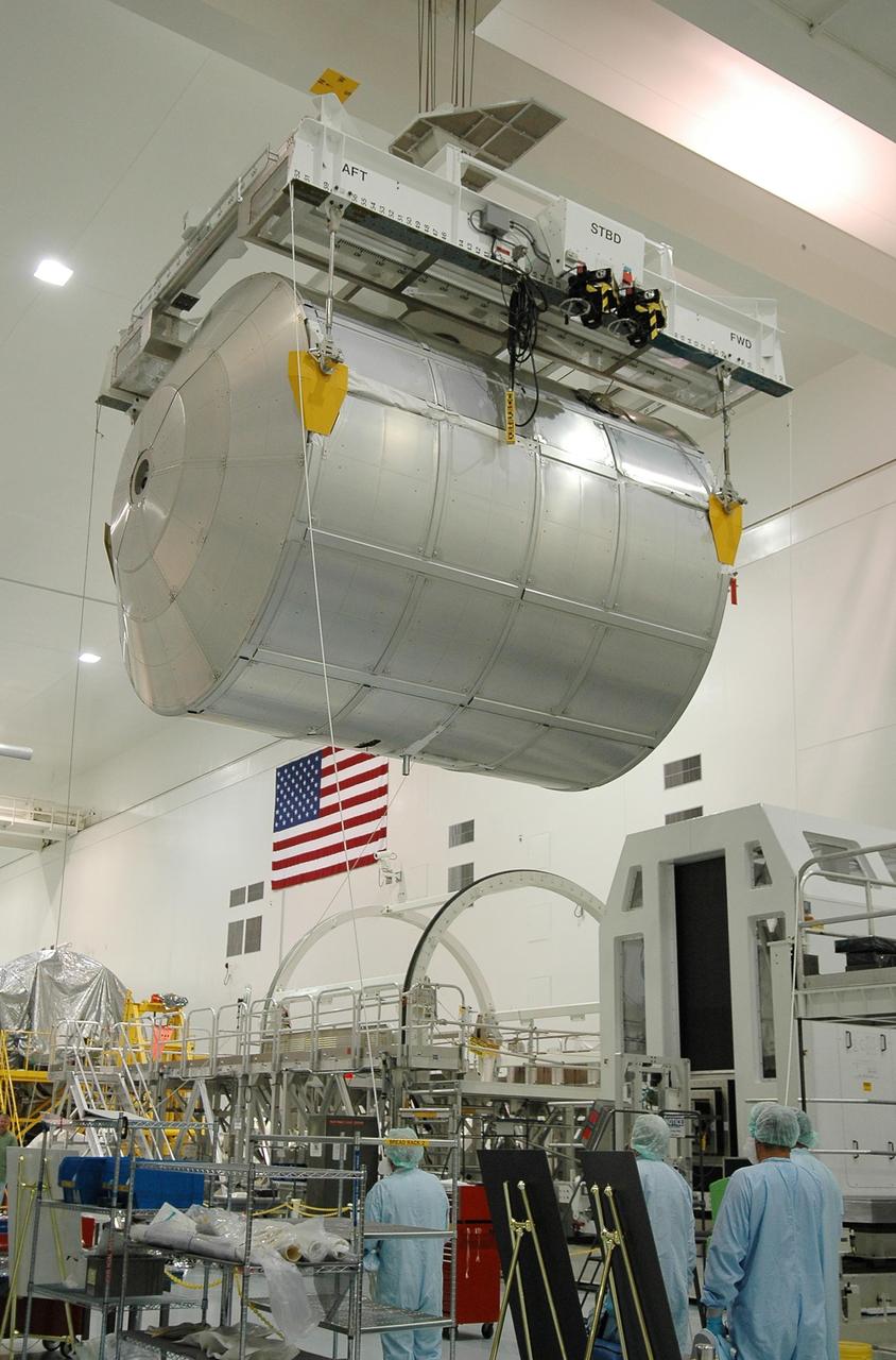 KENNEDY SPACE CENTER, FLA. - In the Space Station Processing Facility, the multi-purpose logistics module Leonardo is moved away from its workstand. The module is being moved to the payload transportation canister for transfer to Launch Pad 39B, where it will be installed in Space Shuttle Discovery's payload bay. Part of the payload for mission STS-121, Leonardo carries tons of supplies and experiments for the International Space Station and its crew. Discovery is scheduled to be launched in a window that extends from July 1 to July 19. Photo credit: NASA/Kim Shiflett