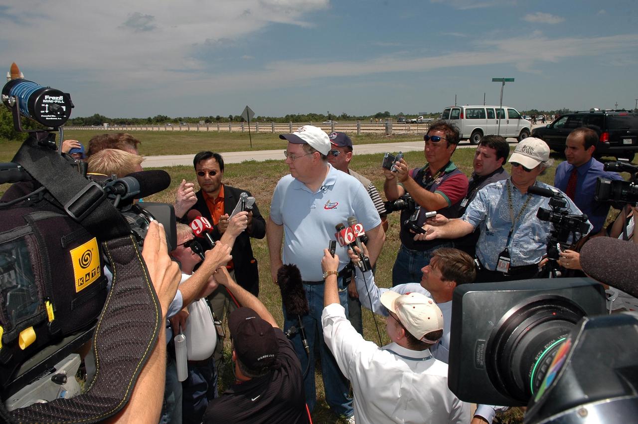 KENNEDY SPACE CENTER, FLA. --  Space Shuttle Program Director Wayne Hale talks to reporters about the rollout of Space Shuttle Discovery to Launch Pad 39B.   First motion from NASA's Vehicle Assembly Building was at 12:45 p.m. EDT.  The rollout is an important step before launch of Discovery on mission STS-121 to the International Space Station. Discovery's launch is targeted for July 1 in a launch window that extends to July 19. During the 12-day mission, Discovery's crew will test new hardware and techniques to improve shuttle safety, as well as deliver supplies and make repairs to the station.  Photo credit: NASA/Kim Shiflett