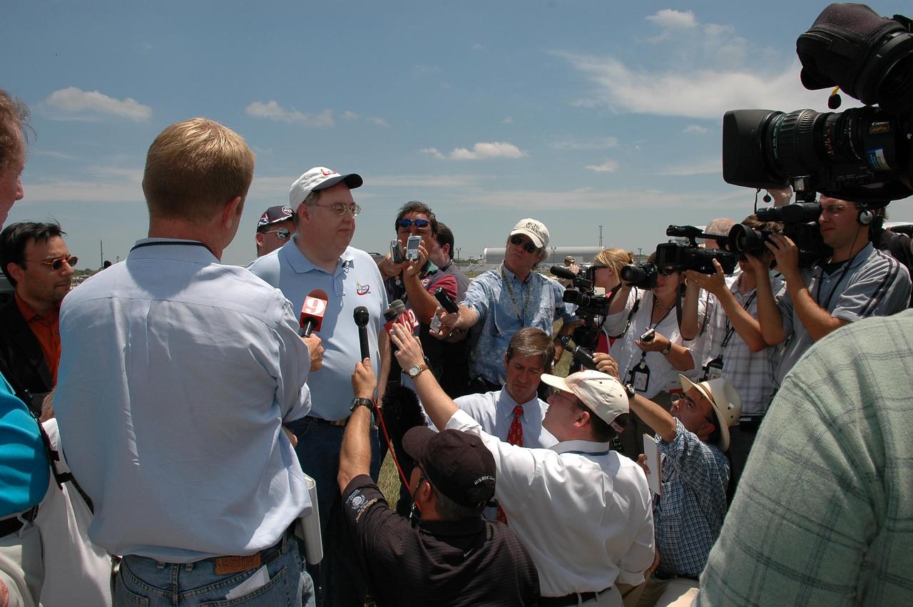 KENNEDY SPACE CENTER, FLA. --  Space Shuttle Program Director Wayne Hale talks to reporters about the rollout of Space Shuttle Discovery to Launch Pad 39B.   First motion from NASA's Vehicle Assembly Building was at 12:45 p.m. EDT.   The rollout is an important step before launch of Discovery on mission STS-121 to the International Space Station. Discovery's launch is targeted for July 1 in a launch window that extends to July 19. During the 12-day mission, Discovery's crew will test new hardware and techniques to improve shuttle safety, as well as deliver supplies and make repairs to the station.  Photo credit: NASA/Kim Shiflett