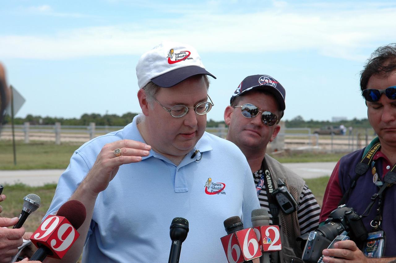 KENNEDY SPACE CENTER, FLA. --  Space Shuttle Program Director Wayne Hale talks to reporters about the rollout of Space Shuttle Discovery to Launch Pad 39B.   First motion from NASA's Vehicle Assembly Building was at 12:45 p.m. EDT.  The rollout is an important step before launch of Discovery on mission STS-121 to the International Space Station. Discovery's launch is targeted for July 1 in a launch window that extends to July 19. During the 12-day mission, Discovery's crew will test new hardware and techniques to improve shuttle safety, as well as deliver supplies and make repairs to the station.  Photo credit: NASA/Kim Shiflett