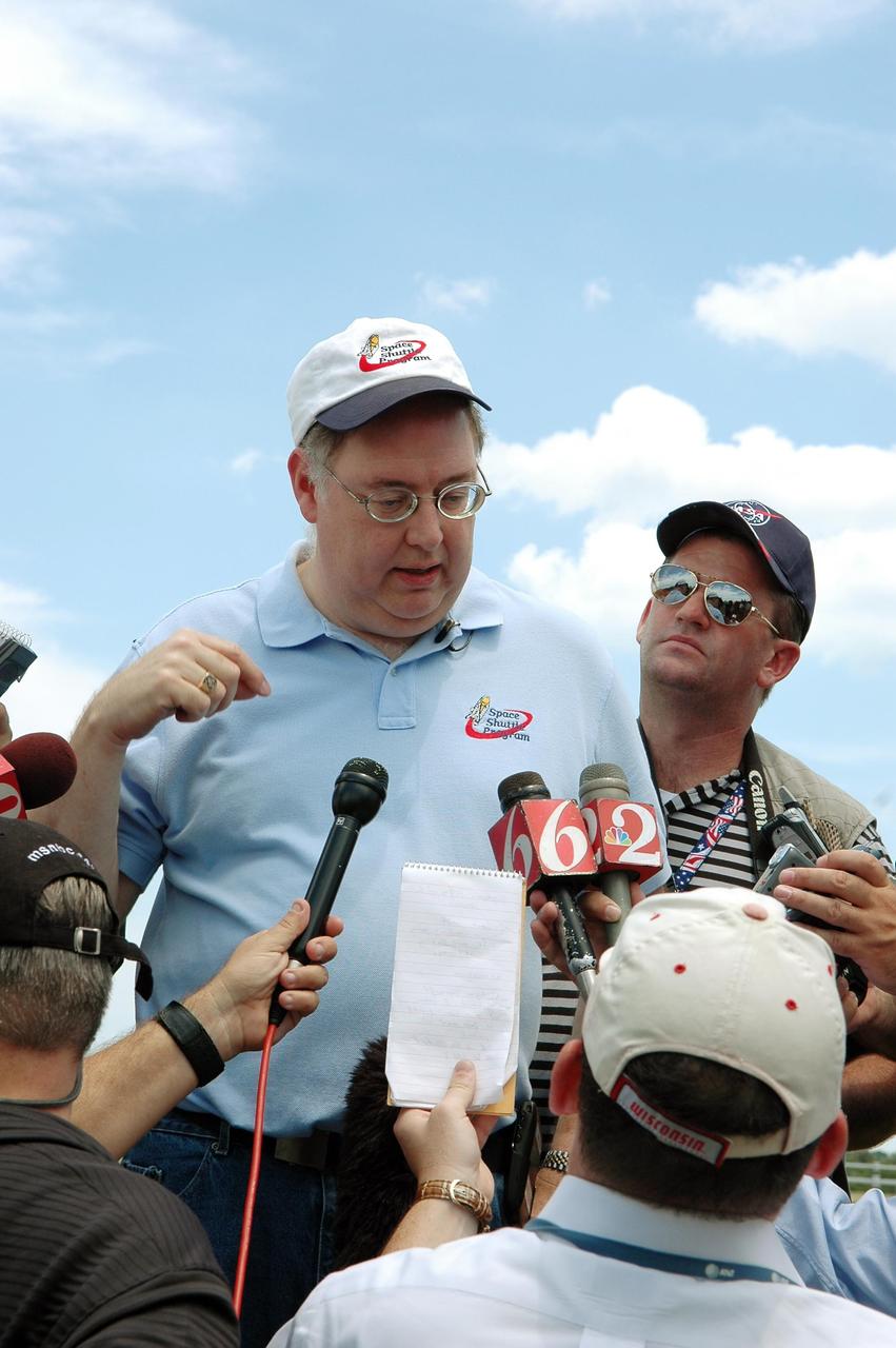 KENNEDY SPACE CENTER, FLA. --  Space Shuttle Program Director Wayne Hale talks to reporters about the rollout of Space Shuttle Discovery to Launch Pad 39B.   First motion from NASA's Vehicle Assembly Building was at 12:45 p.m. EDT.  The rollout is an important step before launch of Discovery on mission STS-121 to the International Space Station. Discovery's launch is targeted for July 1 in a launch window that extends to July 19. During the 12-day mission, Discovery's crew will test new hardware and techniques to improve shuttle safety, as well as deliver supplies and make repairs to the station.  Photo credit: NASA/Kim Shiflett