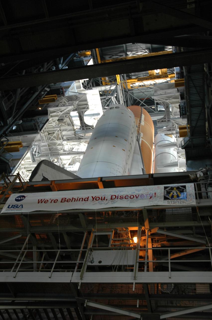 KENNEDY SPACE CENTER, FLA. -- Inside NASA's Vehicle Assembly Building, Space Shuttle Discovery stretches high above the floor as it waits for rollout to Launch Pad 39B. The shuttle sits on a mobile launcher platform atop the crawler-transporter. The rollout is an important step before launch of Discovery on mission STS-121 to the International Space Station. Discovery's launch is targeted for July 1 in a launch window that extends to July 19. During the 12-day mission, Discovery's crew will test new hardware and techniques to improve shuttle safety, as well as deliver supplies and make repairs to the station. Photo credit: NASA/Jack Pfaller