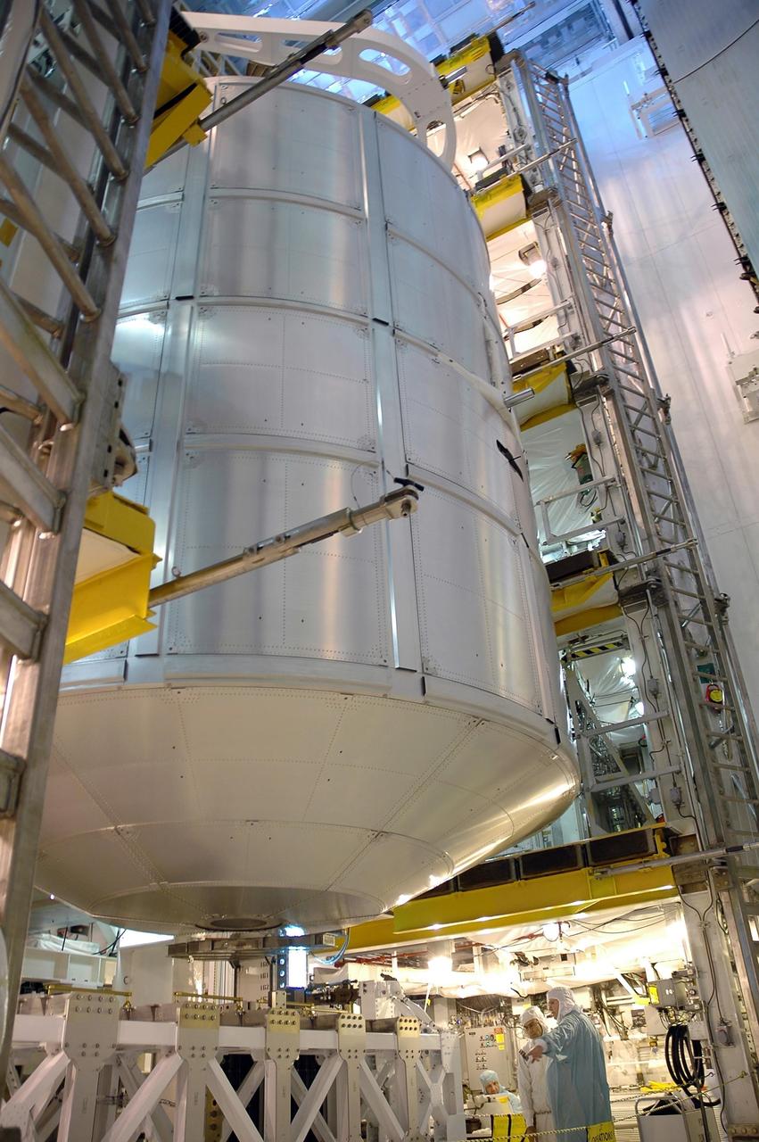 KENNEDY SPACE CENTER, FLA. --   From inside the payload changeout room on the rotating service structure on Launch Pad 39B, the multi-purpose logistics module Leonardo is being moved into Space Shuttle Discovery's payload bay.  The payload ground-handling mechanism (PGHM) is used to transfer the module into the payload bay.  Leonardo is a reusable logistics carrier. It is the primary delivery system used to resupply and return station cargo requiring a pressurized environment. Leonardo is part of the payload on mission STS-121.  Other payloads include the integrated cargo carrier with the mobile transporter reel assembly and a spare pump module, and the lightweight multi-purpose experiment support structure carrier.  Discovery is scheduled to launch in a window extending from July 1 through July 19. Photo credit: NASA/Jack Pfaller