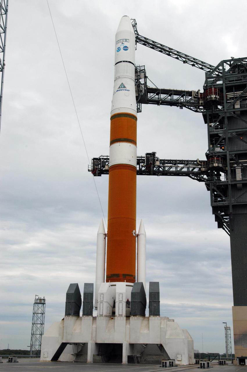 KENNEDY SPACE CENTER, FLA. - The mobile service tower on Launch Complex 37 at Cape Canaveral Air Force Station has been removed from around a Boeing Delta IV rocket as preparations continue to launch the GOES-N satellite. GOES-N is the latest in a series of Geostationary Operational Environmental Satellites for NOAA and NASA. A geostationary orbit is one in which a satellite remains in the same position with respect to the rotating Earth. Thus, the satellite hovers continuously over one position on the Earth's surface, appearing stationary. As a result, GOES provide a constant vigil for the atmospheric "triggers" for severe weather conditions such as tornadoes, flash floods, hail storms, and hurricanes. GOES-N is scheduled for launch May 24 in an hour-long window between 6:11 and 7:11 p.m. EDT. Photo credit: NASA/George Shelton