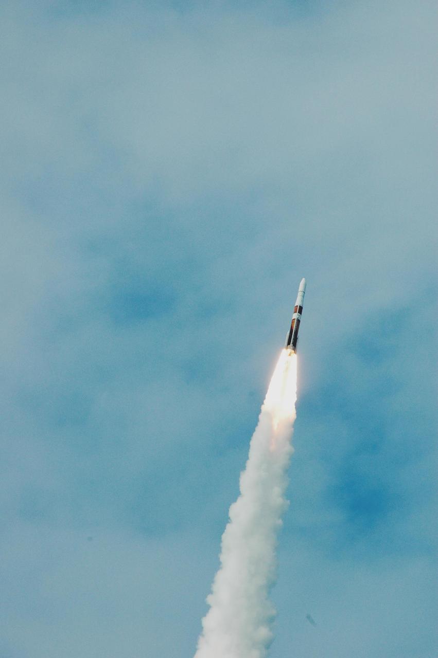 KENNEDY SPACE CENTER, FLA. - The GOES-N satellite roars through the thin cloud cover over the Space Coast atop a Boeing Delta IV rocket. Liftoff from Launch Complex 37 at Cape Canaveral Air Force Station was on time at 6:11 p.m. EDT. GOES-N is the latest in the Earth-monitoring series of Geostationary Operational Environmental Satellites developed by NASA and the National Oceanic and Atmospheric Administration. By maintaining a stationary orbit, hovering over one position on the Earth's surface, GOES will be able to provide a constant vigil for the atmospheric "triggers" for severe weather conditions such as tornadoes, flash floods, hail storms and hurricanes. Photo credit: NASA/Ken Thornsley