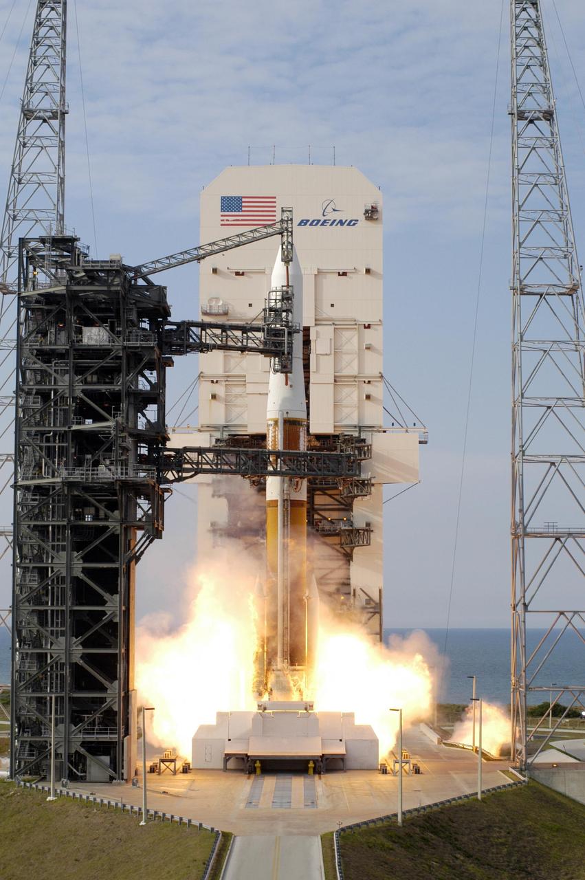 KENNEDY SPACE CENTER, FLA. - Flames spew from under the Boeing Delta IV rocket at liftoff, carrying the GOES-N satellite. Liftoff from Launch Complex 37 at Cape Canaveral Air Force Station was on time at 6:11 p.m. EDT. GOES-N is the latest in the Earth-monitoring series of Geostationary Operational Environmental Satellites developed by NASA and the National Oceanic and Atmospheric Administration. By maintaining a stationary orbit, hovering over one position on the Earth's surface, GOES will be able to provide a constant vigil for the atmospheric "triggers" for severe weather conditions such as tornadoes, flash floods, hail storms and hurricanes. Photo credit: NASA/Tim Terry