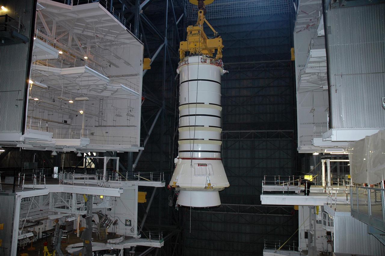 KENNEDY SPACE CENTER, FLA. - In the Vehicle Assembly Building at NASA's Kennedy Space Center, a crane lifts a solid rocket booster segment toward high bay 3 where it will be placed on mobile launcher platform No. 2 for use on mission STS-115.  The mission will deliver a truss and other key components to the International Space Station.  Launch is currently scheduled for late August.  Photo credit: NASA/Charisse Nahser
