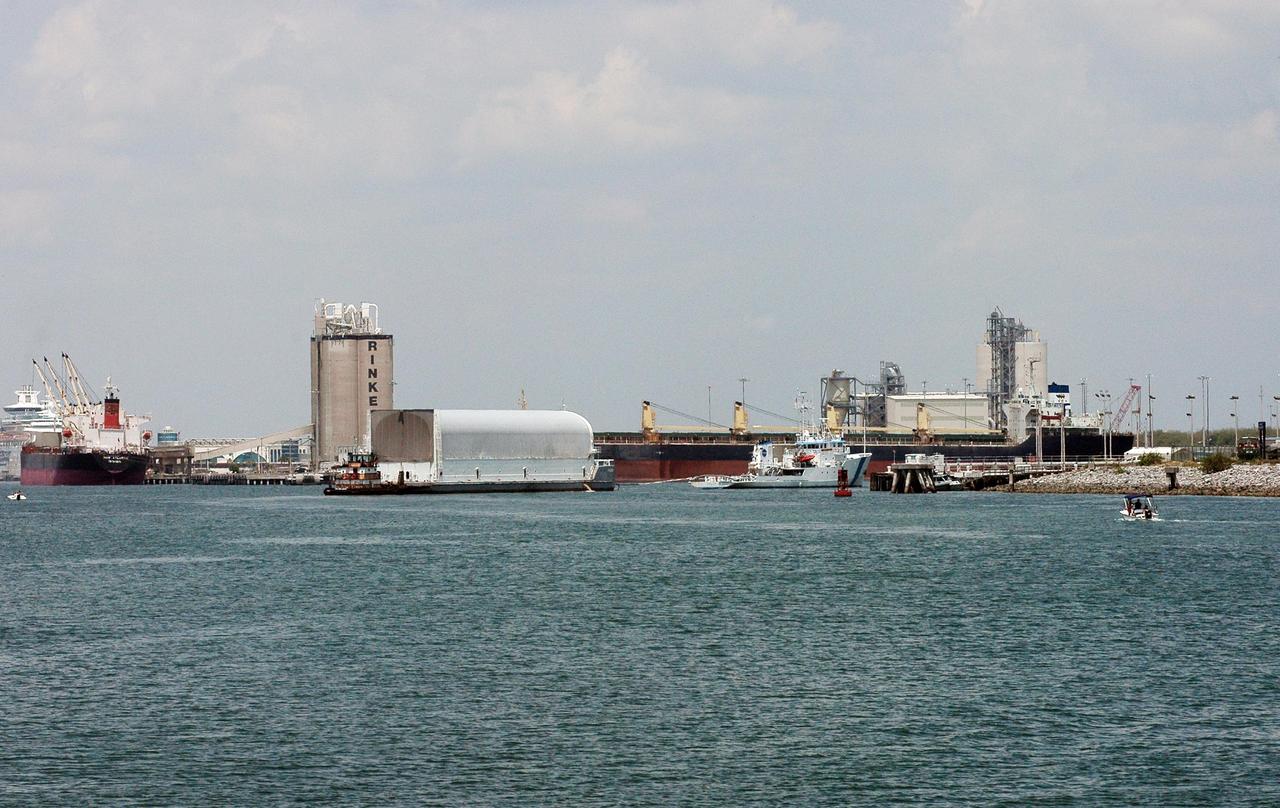KENNEDY SPACE CENTER, FLA. -  The Liberty Star tows the Pegasus barge to Port Canaveral, the last leg of its journey from the Michoud Assembly Facility in New Orleans to Kennedy Space Center. The barge carries the redesigned external fuel tank that will launch Space Shuttle Atlantis on the next shuttle mission, STS-115. A tugboat will continue the journey upriver to the Turn Basin where, after off-loading, the tank will be moved into the Vehicle Assembly Building and lifted into a checkout cell for further work. The tank, designated ET-118, will fly with many major safety changes, including the removal of the protuberance air load ramps.  Photo credit: NASA/Jack Pfaller