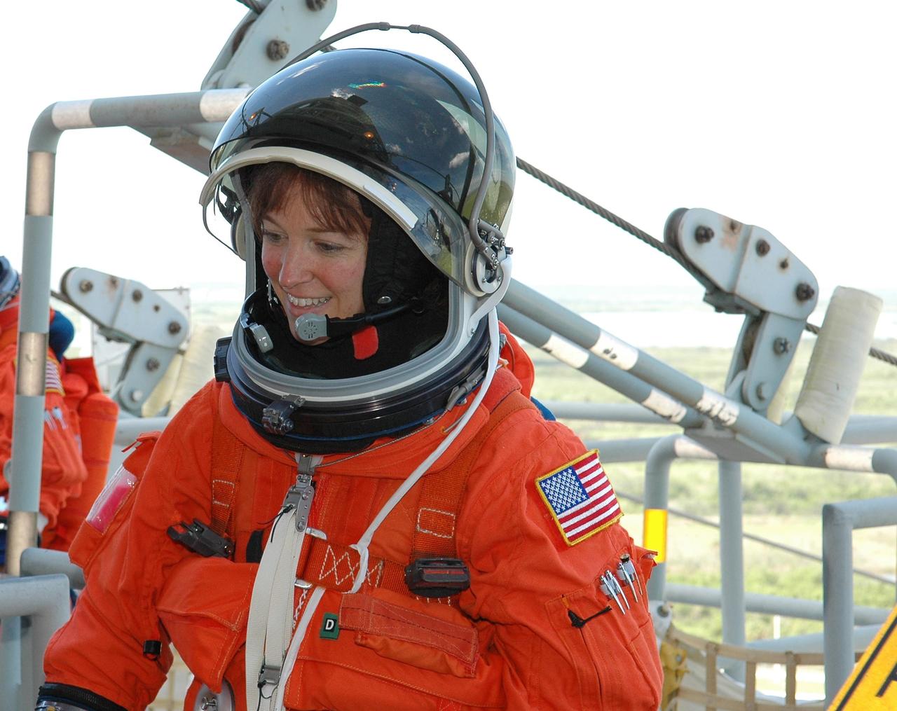 KENNEDY SPACE CENTER, FLA. -  STS-121 Mission Specialist Lisa Nowak takes part in emergency egress practice on Launch Pad 39B.  She is taking part in Terminal Countdown Demonstration Test (TCDT) activities that include a simulated countdown culminating in main engine cutoff.  Mission STS-121 is scheduled to be launched July 1.  Photo credit: NASA/Kim Shiflett