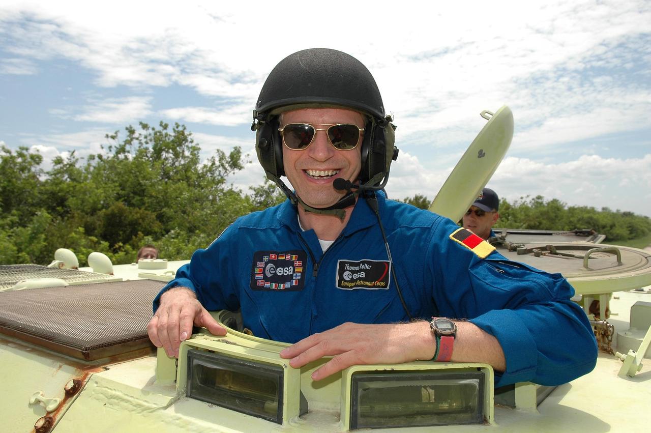 KENNEDY SPACE CENTER, FLA. -   STS-121 Mission Specialist Thomas Reiter is taking his turn driving an M-113, which is an armored personnel carrier.  Reiter is from Germany and represents the European Space Agency.  The STS-121 crew is taking turns driving the M-113 as part of Terminal Countdown Demonstration Test activities, which include emergency egress training from the pad and a simulated countdown.  Mission STS-121 is designated for launch on July 1.   Photo credit: NASA/Kim Shiflett