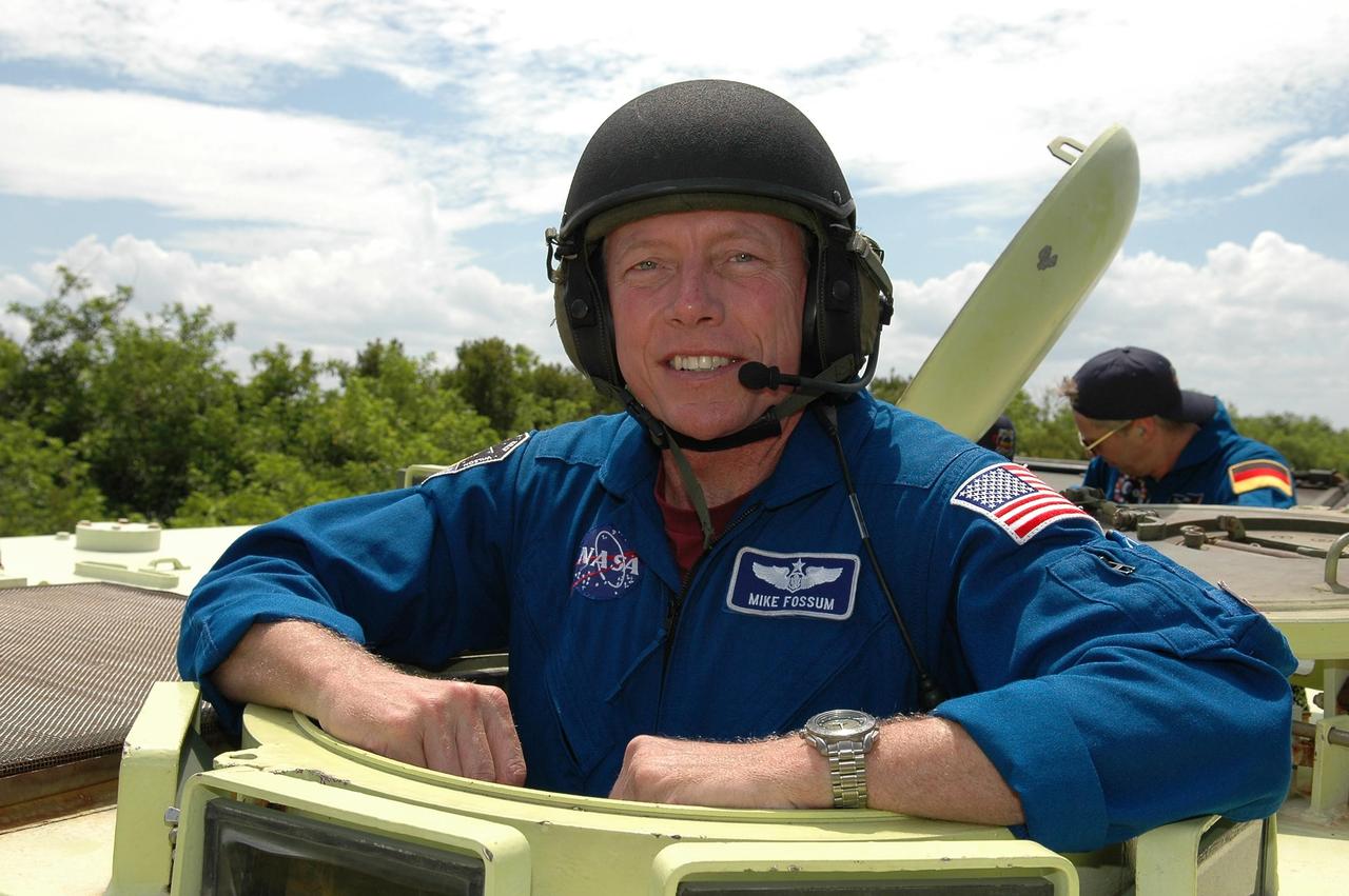 KENNEDY SPACE CENTER, FLA. -   STS-121 Mission Specialist Michael Fossum takes his turn in an M-113, which is an armored personnel carrier. The STS-121 crew is taking turns driving the M-113 as part of Terminal Countdown Demonstration Test activities, which include emergency egress training from the pad and a simulated countdown.  Mission STS-121 is designated for launch on July 1.   Photo credit: NASA/Kim Shiflett