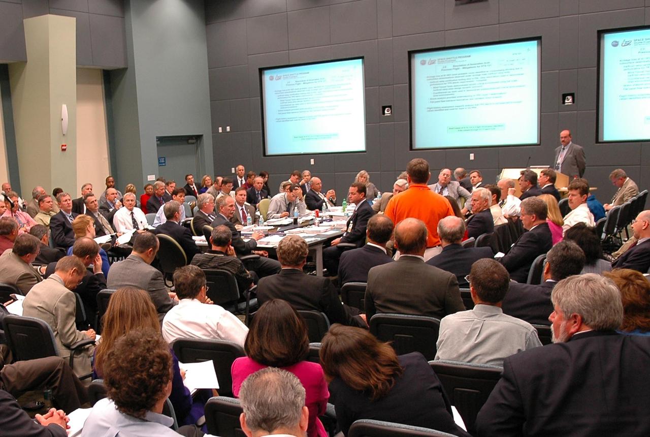 KENNEDY SPACE CENTER, FLA. - Space Shuttle Program and mission managers meet for the traditional Flight Readiness Review, a thorough assessment of preparations for the mission. Among those seated at the table on the left are Center Director Jim Kennedy, Associate Administrator for Space Operations William Gerstenmaier and Marshall Space Flight Center Director Dave King. Shuttle Program Manager Wayne Hale is seated under the center screen on the back wall. Also attending is NASA Administrator Mike Griffin. The June 16-17 meeting is designed to produce a number of key decisions about Discovery's mission, STS-121, including selection of an official launch date. Photo credit: NASA/Kim Shiflett