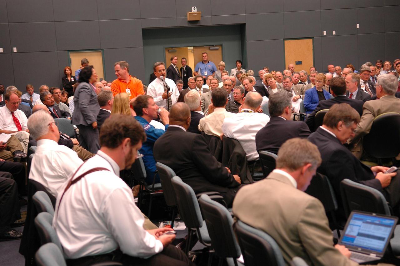 KENNEDY SPACE CENTER, FLA. - Space Shuttle Program and mission managers meet for the traditional Flight Readiness Review, a thorough assessment of preparations for the mission. Listening to a comment from attendees is NASA Administrator Mike Griffin (fourth to the right of the speaker) and Associate Administrator for Space Operations William Gerstenmaier and KSC Deputy Director Bill Parsons, at far right. The June 16-17 meeting is designed to produce a number of key decisions about Discovery's mission, STS-121, including selection of an official launch date. Photo credit: NASA/Kim Shiflett