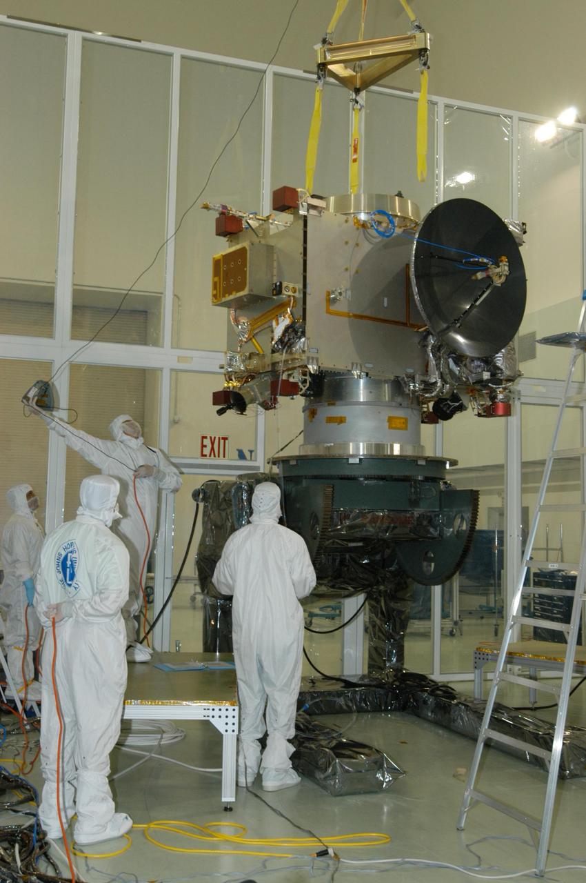 KENNEDY SPACE CENTER, FLA. - At Astrotech Space Operations in Titusville, Fla., a technician works a guideline to the overhead crane as the STEREO spacecraft "B" is being moved to a stand nearby for testing. STEREO stands for Solar Terrestrial Relations Observatory. The STEREO mission is the first to take measurements of the sun and solar wind in 3-dimension. This new view will improve our understanding of space weather and its impact on the Earth. STEREO is expected to lift off aboard a Boeing Delta II rocket on July 22. Photo credit: NASA/George Shelton