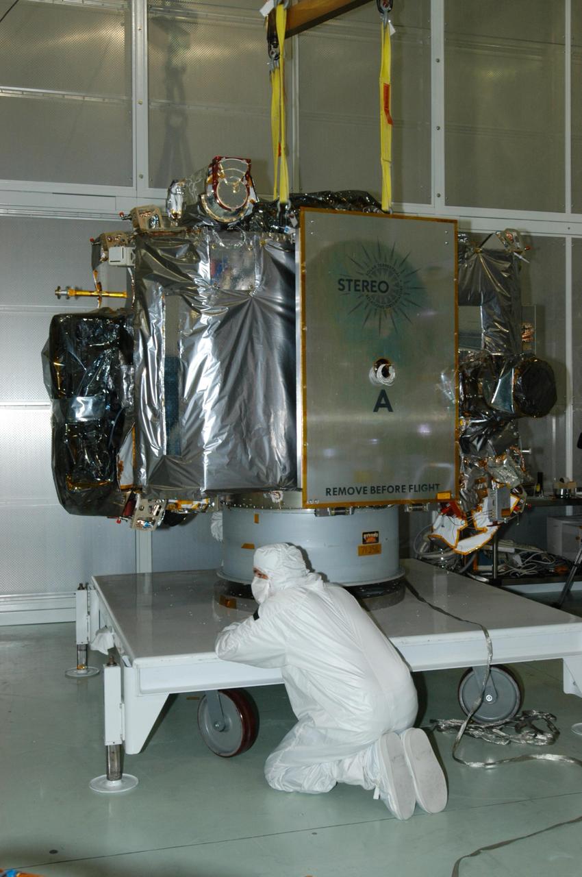 KENNEDY SPACE CENTER, FLA. - At Astrotech Space Operations in Titusville, Fla., the STEREO spacecraft "A" is ready to be moved to a tilt table. On the table, the observatory will be tilted down so that technicians can perform the final comprehensive performance test of the instruments, verifying the instrument is fully functional before flight. After a rotation, this configuration also allows deployment tests to be done on the solar arrays. STEREO stands for Solar Terrestrial Relations Observatory. The STEREO mission is the first to take measurements of the sun and solar wind in 3-dimension. This new view will improve our understanding of space weather and its impact on the Earth. STEREO is expected to lift off aboard a Boeing Delta II rocket on July 22. Photo credit: NASA/George Shelton