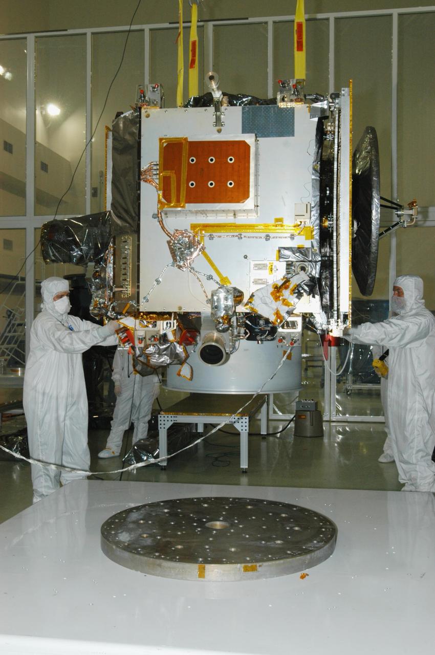 KENNEDY SPACE CENTER, FLA. - At Astrotech Space Operations in Titusville, Fla., the STEREO spacecraft "A" is guided away from its stand for transfer to a tilt table, behind it. On the table, the observatory will be tilted down so that technicians can perform the final comprehensive performance test of the instruments, verifying the instrument is fully functional before flight. After a rotation, this configuration also allows deployment tests to be done on the solar arrays. STEREO stands for Solar Terrestrial Relations Observatory. The STEREO mission is the first to take measurements of the sun and solar wind in 3-dimension. This new view will improve our understanding of space weather and its impact on the Earth. STEREO is expected to lift off aboard a Boeing Delta II rocket on July 22. Photo credit: NASA/George Shelton