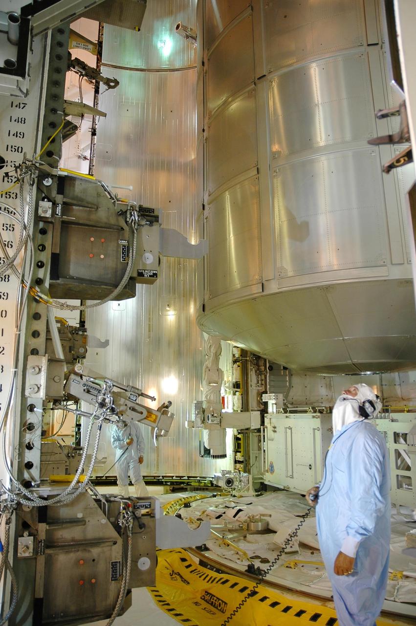 KENNEDY SPACE CENTER, FLA. - At Launch Pad 39B, the payloads for mission STS-121 are being moved from the payload changeout room into Space Shuttle Discovery's payload bay. Here, the multi-purpose logistics module Leonardo is being transferred. Other payloads include the integrated cargo carrier that holds the mobile transporter reel assembly the astronauts will replace on the station and a spare pump module. Discovery is scheduled to launch at 3:48 p.m. July 1 carrying a crew of seven on the 12-day mission to the International Space Station. Photo credit: NASA/Charisse Nahser