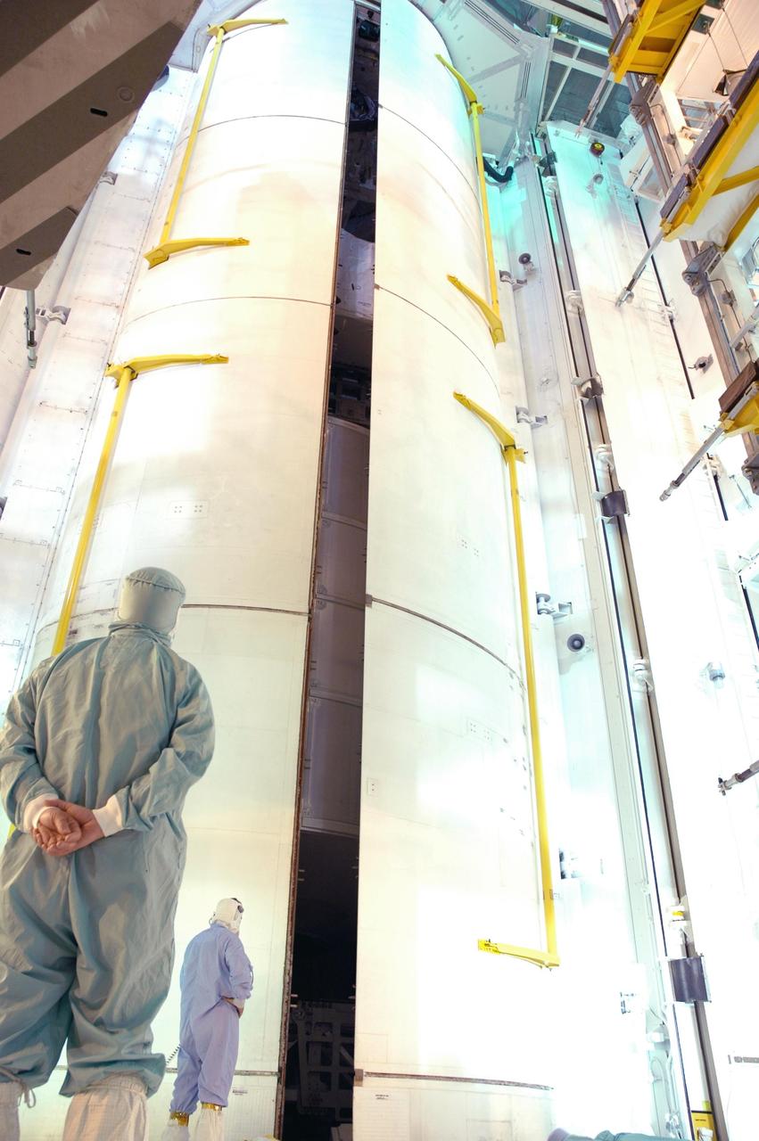 KENNEDY SPACE CENTER, FLA. -   At Launch Pad 39B, both of Space Shuttle Discovery's payload bay doors are closing for launch.  Inside the payload bay are the multi-purpose logistics module Leonardo and the integrated cargo carrier.  Discovery is scheduled to launch on mission STS-121 at 3:49 p.m. July 1 carrying a crew of seven on the 12-day mission to the International Space Station. Photo credit: NASA/Jim Grossmann