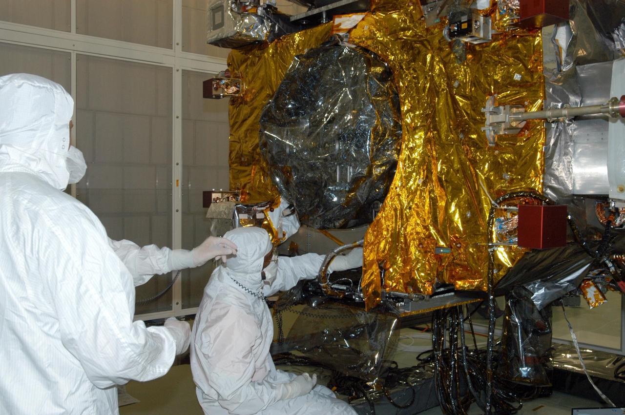 KENNEDY SPACE CENTER, FLA. -  At Astrotech Space Operations in Titusville, Fla., blanket insulation is being installed on observatory "A" of the STEREO spacecraft.  STEREO, which stands for Solar Terrestrial Relations Observatory, consists of two spacecraft whose mission is to take measurements of the sun and solar wind in 3-D, for the first time. This new view will improve our understanding of space weather and its impact on the Earth.  Preparations are under way for a liftoff aboard a Delta rocket no earlier than July 30.  Photo credit: NASA/Photo credit: NASA/Jack Pfaller