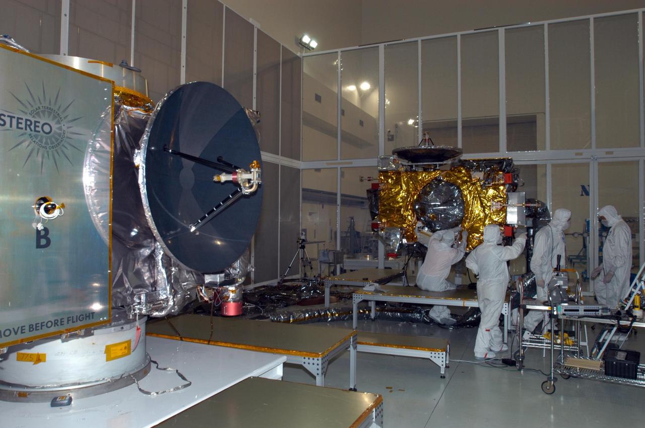 KENNEDY SPACE CENTER, FLA. -  At Astrotech Space Operations in Titusville, Fla., technicians complete installation of blanket insulation on observatory "A" of the STEREO spacecraft.  STEREO, which stands for Solar Terrestrial Relations Observatory, consists of two spacecraft whose mission is to take measurements of the sun and solar wind in 3-D, for the first time. This new view will improve our understanding of space weather and its impact on the Earth.  Preparations are under way for a liftoff aboard a Delta rocket no earlier than July 30.  Photo credit: NASA/Photo credit: NASA/Jack Pfaller