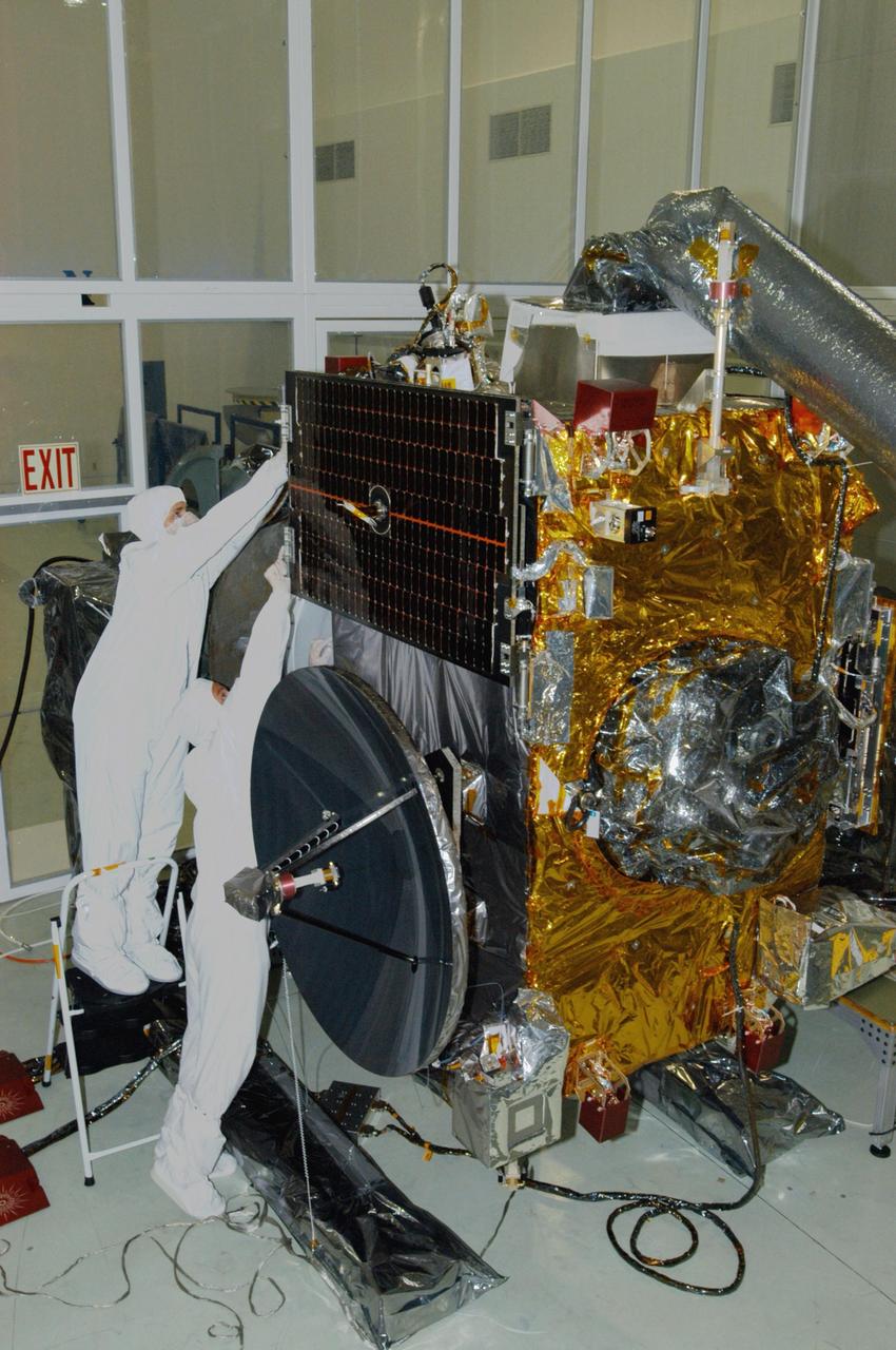 KENNEDY SPACE CENTER, FLA. - At Astrotech Space Operations in Titusville, Fla., technicians prepare to deploy the solar panel on the STEREO observatory "A." STEREO, which stands for Solar Terrestrial Relations Observatory, consists of two spacecraft whose mission is to take measurements of the sun and solar wind in 3-D, for the first time. This new view will improve our understanding of space weather and its impact on the Earth. Preparations are under way for a liftoff aboard a Delta rocket no earlier than July 30. Photo credit: NASA/George Shelton