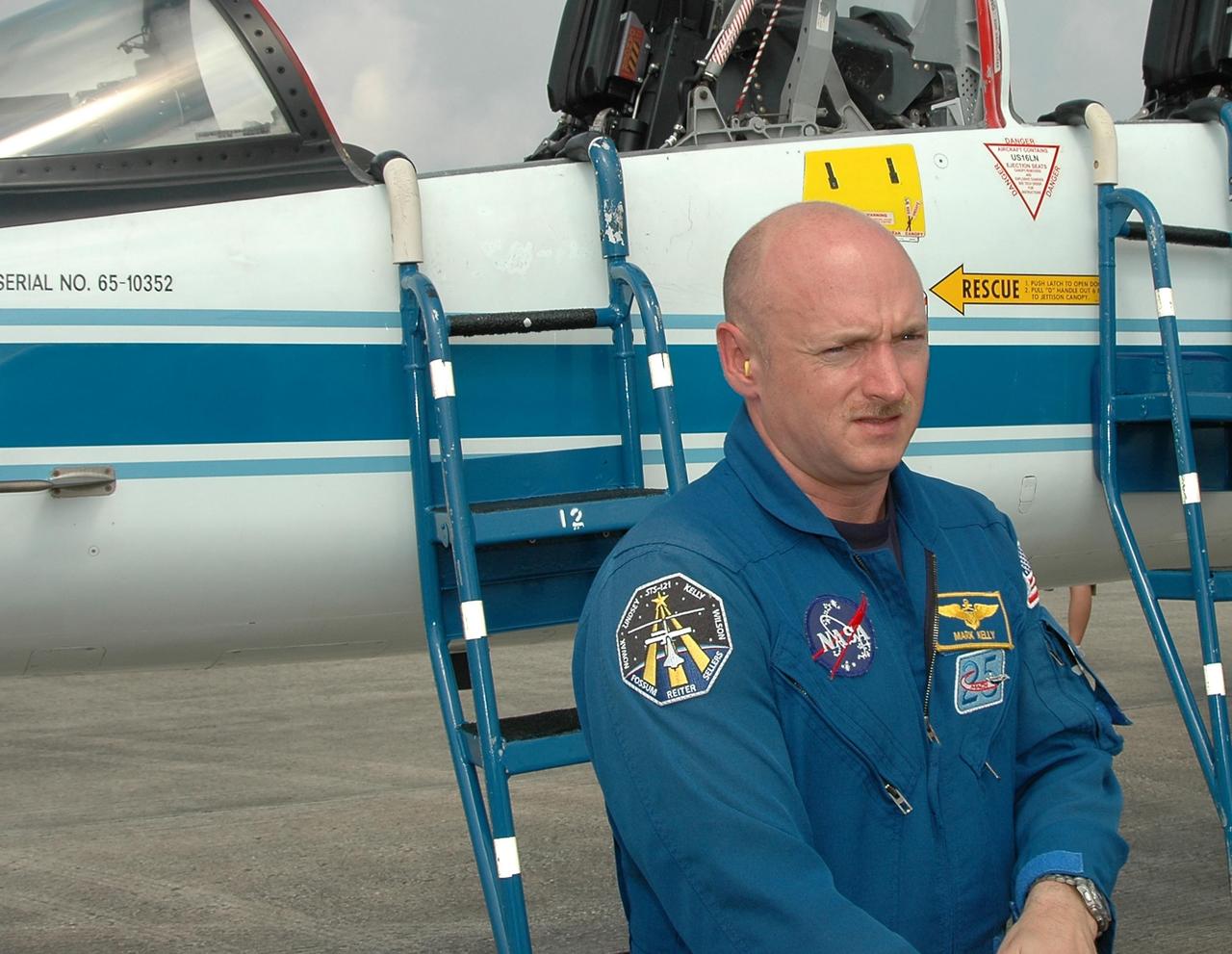 KENNEDY SPACE CENTER, FLA. -    STS-121 Pilot Mark Kelly arrives at the Shuttle Landing Facility to get ready for launch on July 1.  The launch will be his second space flight.  During the 12-day mission, the STS-121 crew will test new equipment and procedures to improve shuttle safety, as well as deliver supplies and make repairs to the International Space Station. This mission is the 115th shuttle flight and the 18th U.S. flight to the International Space Station.  Photo credit: NASA/Kim Shiflett