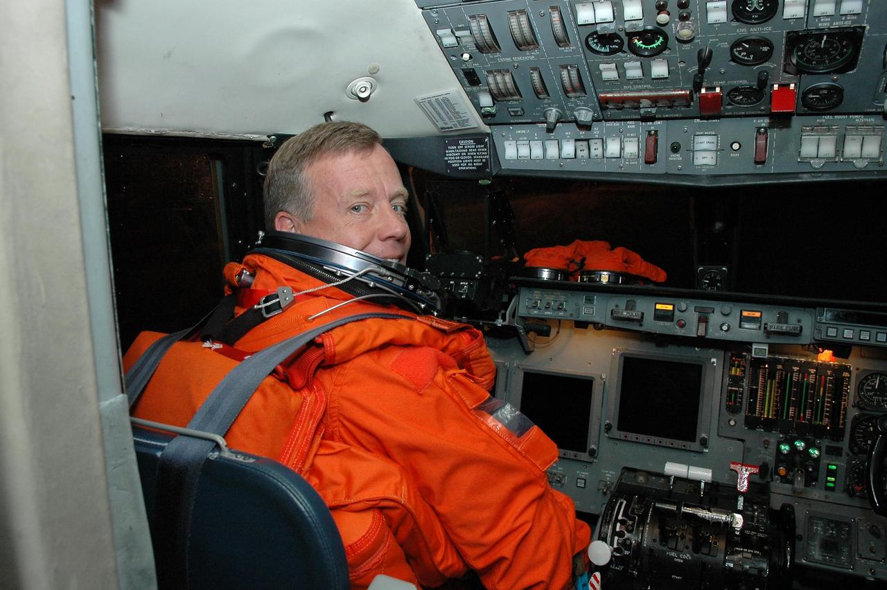 KENNEDY SPACE CENTER, FLA. -  Inside the Shuttle Training Aircraft (STA), STS-121 Commander Steven Lindsey settles into his seat in the cockpit.  Lindsey and Pilot Mark Kelly will be making practice landings in preparation for the July 1 launch of Space Shuttle Discovery.  The STA is a Grumman American Aviation-built Gulf Stream II jet that was modified to simulate an orbiter’s cockpit, motion and visual cues, and handling qualities. In flight, the STA duplicates the orbiter’s atmospheric descent trajectory from approximately 35,000 feet altitude to landing on a runway. Because the orbiter is unpowered during re-entry and landing, its high-speed glide must be perfectly executed the first time.  Photo credit: NASA/Kim Shiflett