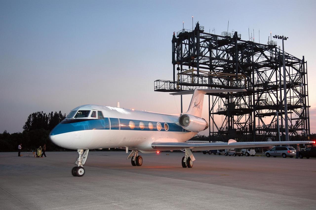 KENNEDY SPACE CENTER, FLA. -  In the early dawn, STS-121 Pilot Mark Kelly is ready for takeoff from the Shuttle Training Facility to practice landing a shuttle in preparation for the July 1 launch of Space Shuttle Discovery.   The STA is a Grumman American Aviation-built Gulf Stream II jet that was modified to simulate an orbiter’s cockpit, motion and visual cues, and handling qualities. In flight, the STA duplicates the orbiter’s atmospheric descent trajectory from approximately 35,000 feet altitude to landing on a runway. Because the orbiter is unpowered during re-entry and landing, its high-speed glide must be perfectly executed the first time.  Photo credit: NASA/Kim Shiflett