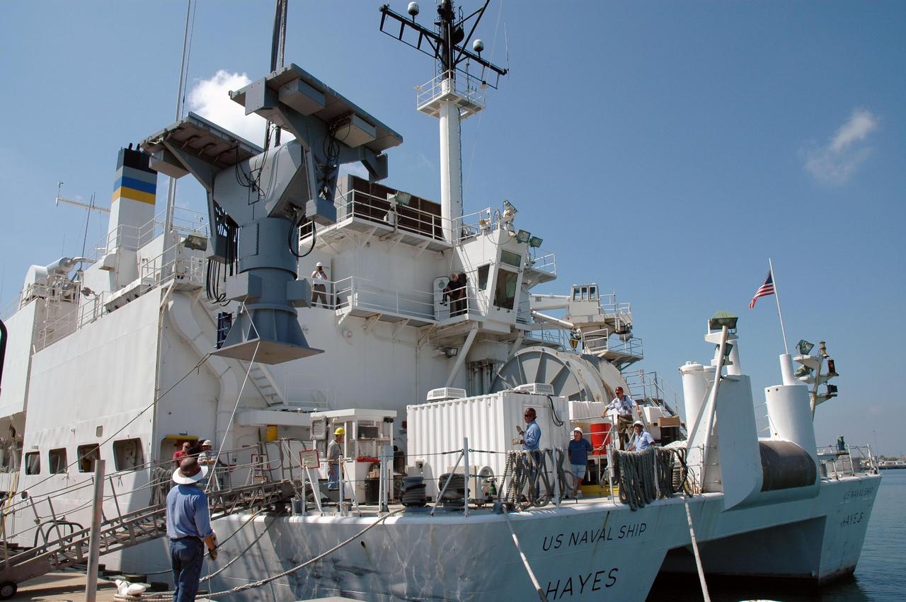 KENNEDY SPACE CENTER, FLA. -   An X-band radar is transferred onto the U.S. Naval Ship Hayes at Port Canaveral in Florida to support the July 1 launch of Space Shuttle Discovery on mission STS-121.   There are two Continuous Pulse Doppler X-band radars located on ships for the STS-121 launch.  The other one is mounted on a booster recovery ship downrange of the launch site. The two radars provide velocity and differential Shuttle/debris motion information.  Combined with the C-band radar located at the Haulover Canal near the launch site, they provide high definition images of any debris that might fall from the external tank/shuttle.  The X-band data (screen captures) will be sent from the ships via satellite link to the National Center for Atmospheric Research site.  Photo credit: NASA/Jim Grossmann