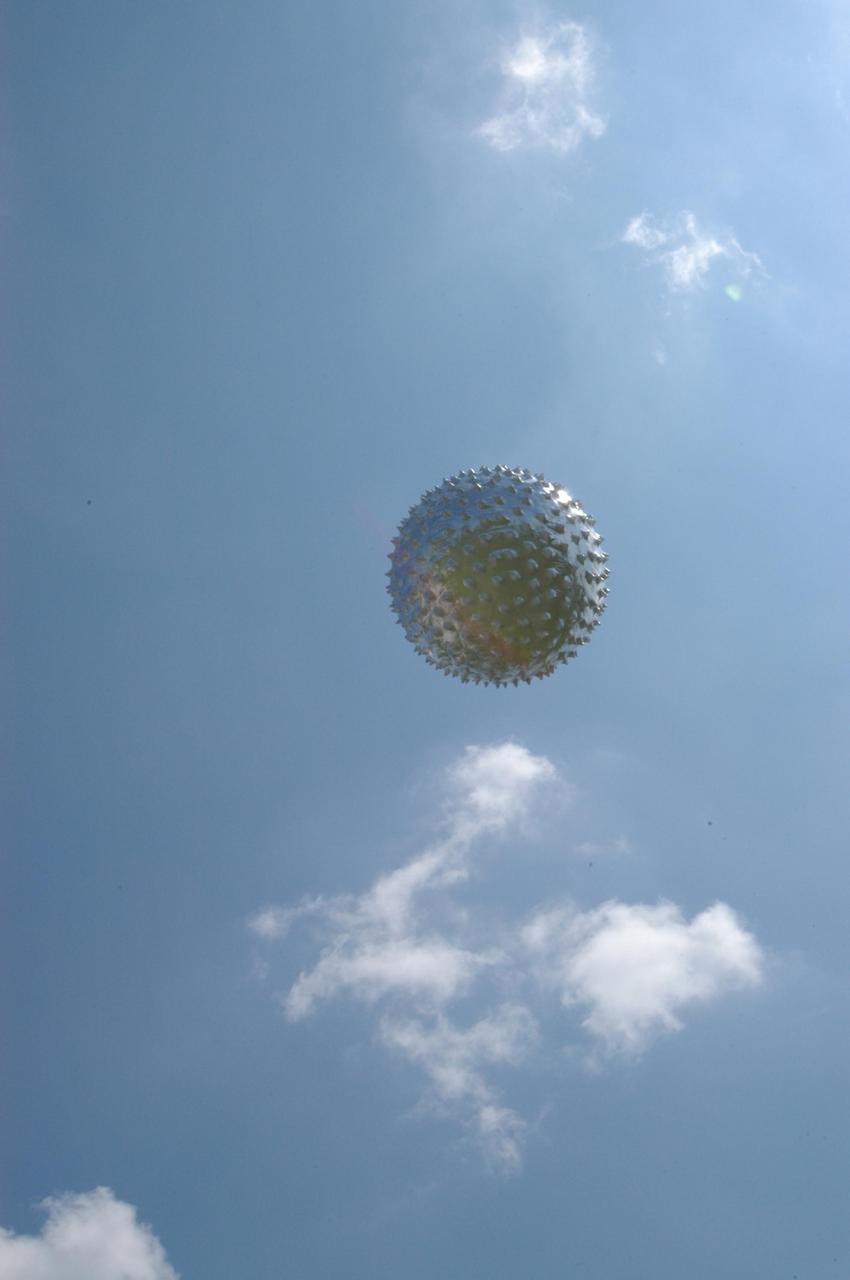 KENNEDY SPACE CENTER, FLA. -   An upper-level weather balloon sails into the sky after  release from the Cape Canaveral weather station in Florida.  The release was planned as part of a media tour prior to the launch of Space Shuttle Discovery on mission STS-121 July 1. The radar-tracked balloon detects wind shears that can affect a shuttle launch.  At the facility, which is operated by the U.S. Air Force 45th Weather Squadron, media saw the tools used by the weather team to create the forecast for launch day. They received a briefing on how the launch weather forecast is developed by Shuttle Weather Officer Kathy Winters and met the forecasters for the space shuttle and the expendable launch vehicles. Also participating were members of the Applied Meteorology Unit who provide special expertise to the forecasters by analyzing and interpreting unusual or inconsistent weather data. The media were able to see the release of the Rawinsonde weather balloon carrying instruments aloft to be used as part of developing the forecast.  Photo credit: NASA/George Shelton
