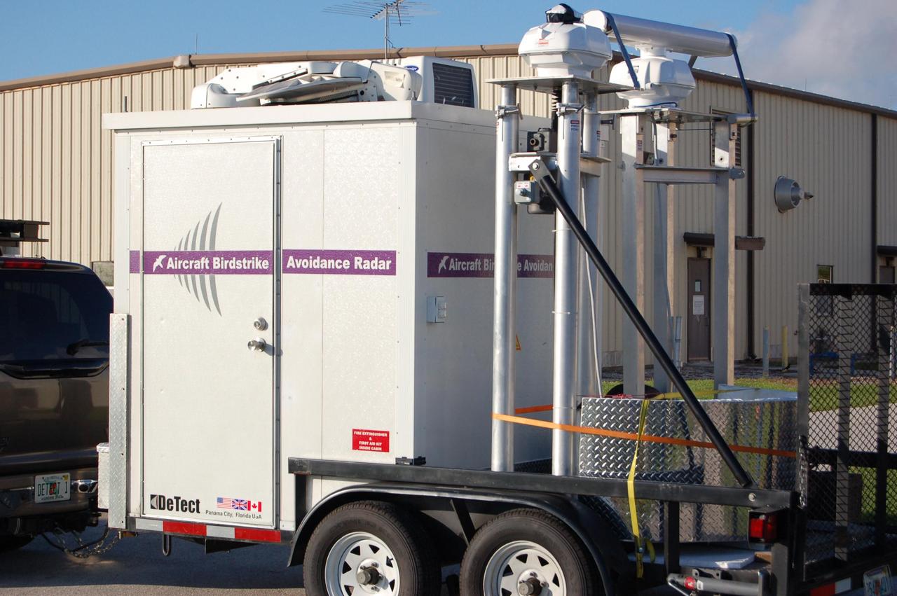 KENNEDY SPACE CENTER, FLA. - Bird detection radar is delivered near Launch Pad 39B before the July 1 launch of Space Shuttle Discovery on mission STS-121. When birds, especially vultures, are near the shuttle during a launch, impact on a critical area is possible and could cause catastrophic damage to the vehicle. Already proven affective for aviation where threats posed by bird strikes have been a problem, the avian radar, known as Aircraft Birdstrike Avoidance Radar, provides horizontal and vertical scanning and can monitor either launch pad for movement of vultures around them. If data relayed from the avian radar indicates large birds are dangerously close to the vehicle, controllers could hold the countdown. Photo credit: NASA/Gianni Woods