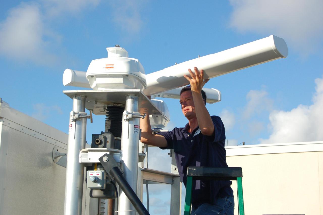 KENNEDY SPACE CENTER, FLA. - Bird detection radar is set up near Launch Pad 39B before the July 1 launch of Space Shuttle Discovery on mission STS-121. When birds, especially vultures, are near the shuttle during a launch, impact on a critical area is possible and could cause catastrophic damage to the vehicle. Already proven affective for aviation where threats posed by bird strikes have been a problem, the avian radar, known as Aircraft Birdstrike Avoidance Radar, provides horizontal and vertical scanning and can monitor either launch pad for movement of vultures around them. If data relayed from the avian radar indicates large birds are dangerously close to the vehicle, controllers could hold the countdown. Photo credit: NASA/Gianni Woods