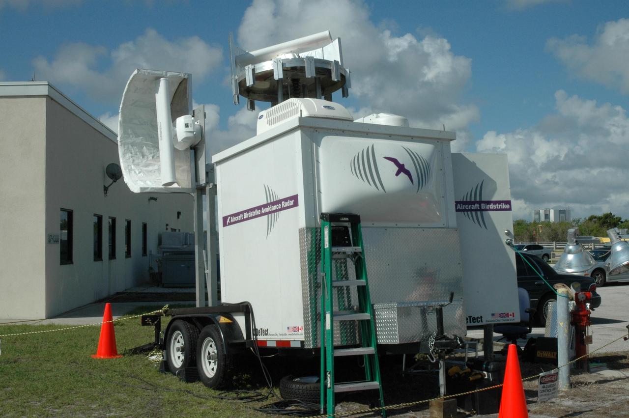 KENNEDY SPACE CENTER, FLA. - Two bird detection radars have been set up near Launch Pad 39B to get ready for the July 1 launch of Space Shuttle Discovery on mission STS-121. When birds, especially vultures, are near the shuttle during a launch, impact on a critical area is possible and could cause catastrophic damage to the vehicle. Already proven affective for aviation where threats posed by bird strikes have been a problem, the avian radar, known as Aircraft Birdstrike Avoidance Radar, provides horizontal and vertical scanning and can monitor either launch pad for movement of vultures around them. If data relayed from the avian radar indicates large birds are dangerously close to the vehicle, controllers could hold the countdown. Photo credit: NASA/Dimitri Gerondidakis