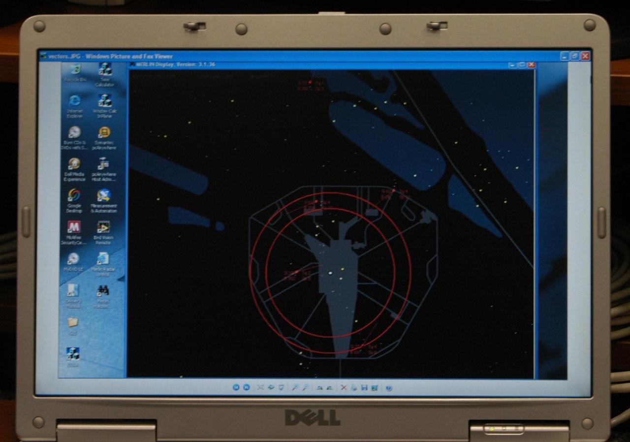 KENNEDY SPACE CENTER, FLA. - This radar image shows the presence of large birds around Launch Pad 39B. The data is being relayed from the avian radars recently set up on the pad. The computer is one of two set up in Firing Room 4 of the Launch Control Center. When birds, especially vultures, are near the shuttle during a launch, impact on a critical area is possible and could cause catastrophic damage to the vehicle. Already proven affective for aviation where threats posed by bird strikes have been a problem, the avian radar, known as Aircraft Birdstrike Avoidance Radar, provides horizontal and vertical scanning and can monitor either launch pad for movement of vultures around them. If data relayed from the avian radar indicates large birds are dangerously close to the vehicle, controllers could hold the countdown. Photo credit: NASA/George Shelton