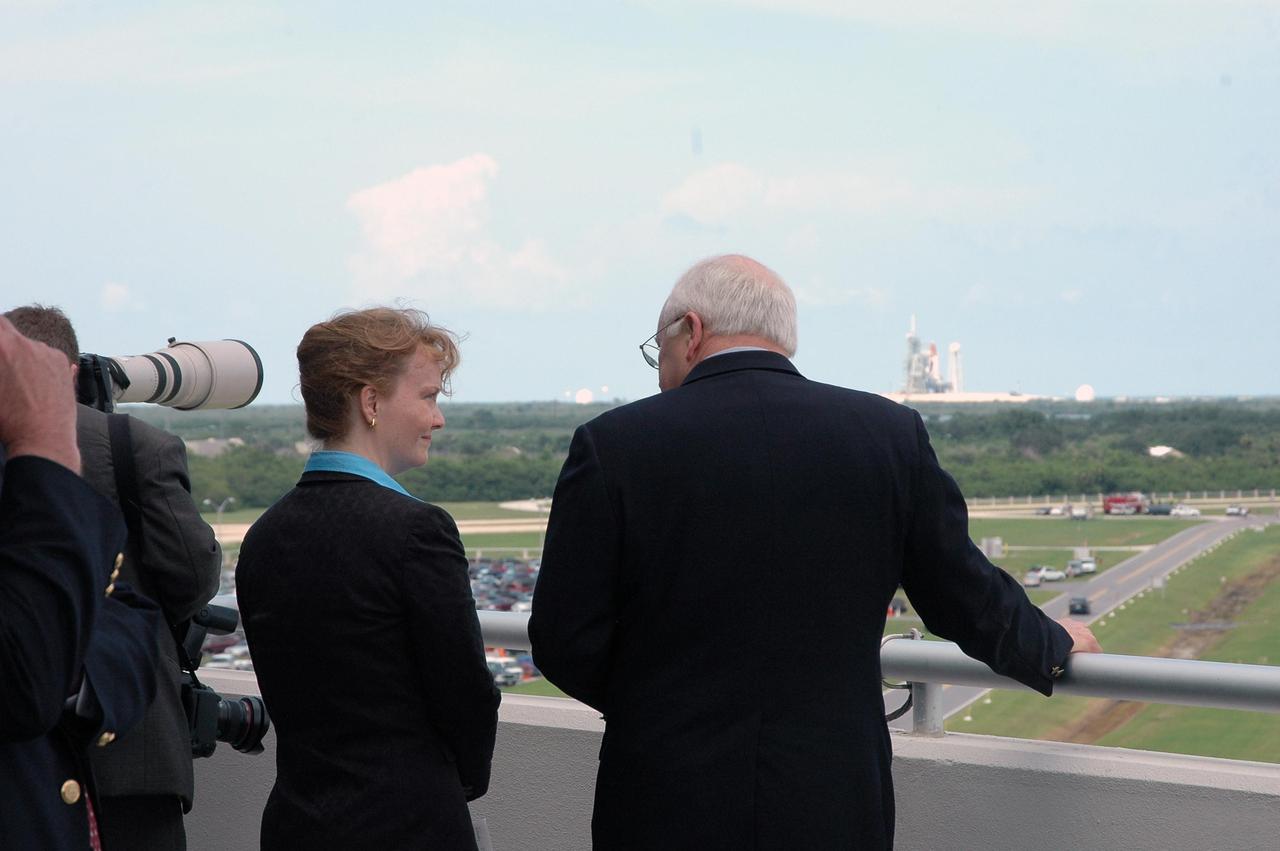 KENNEDY SPACE CENTER, FLA. -  From the viewing area of the Operations and Support Building II, U.S. Vice President Dick Cheney has a direct view to Launch Pad 39B and Space Shuttle Discovery.  Cheney flew in to view the launch of Discovery on mission STS-121. Standing next to him is Shana Dale, NASA deputy administrator.   Photo credit: NASA/Kim Shiflett