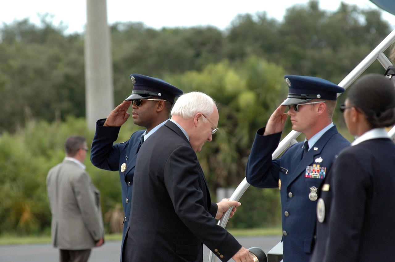 KENNEDY SPACE CENTER, FLA. - On the Skid Strip at Cape Canaveral Air Force Station in Florida, U.S. Vice President Dick Cheney is saluted by officers from Patrick Air Force Base as he boards Air Force Two for a return trip to Washington.  Cheney and his family flew in earlier to witness the launch of Space Shuttle Discovery on mission STS-121.  The launch was scrubbed due to weather concerns and postponed 24 hours.     Photo credit: NASA/Kim Shiflett
