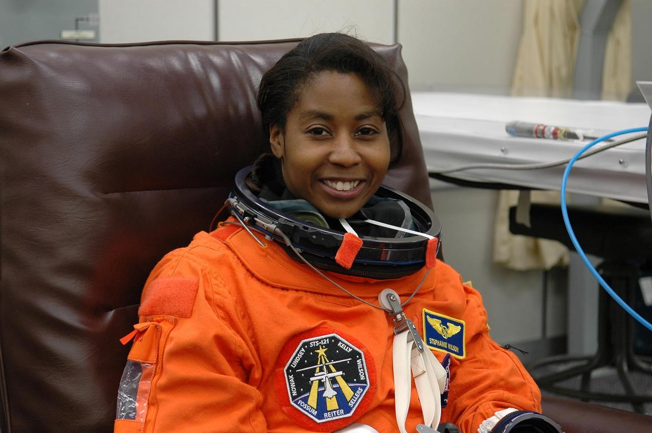 KENNEDY SPACE CENTER, FLA. - For the second time in two days, STS-121 Mission Specialist Stephanie Wilson is donning her launch suit for another launch attempt on Space Shuttle Discovery.  The first launch attempt July 1 was scrubbed due to weather concerns and postponed 24 hours.  The launch is the 115th shuttle flight and the 18th U.S. flight to the International Space Station.  During the 12-day mission, the STS-121 crew will test new equipment and procedures to improve shuttle safety, as well as deliver supplies and make repairs to the International Space Station. Photo credit: NASA/Kim Shiflett