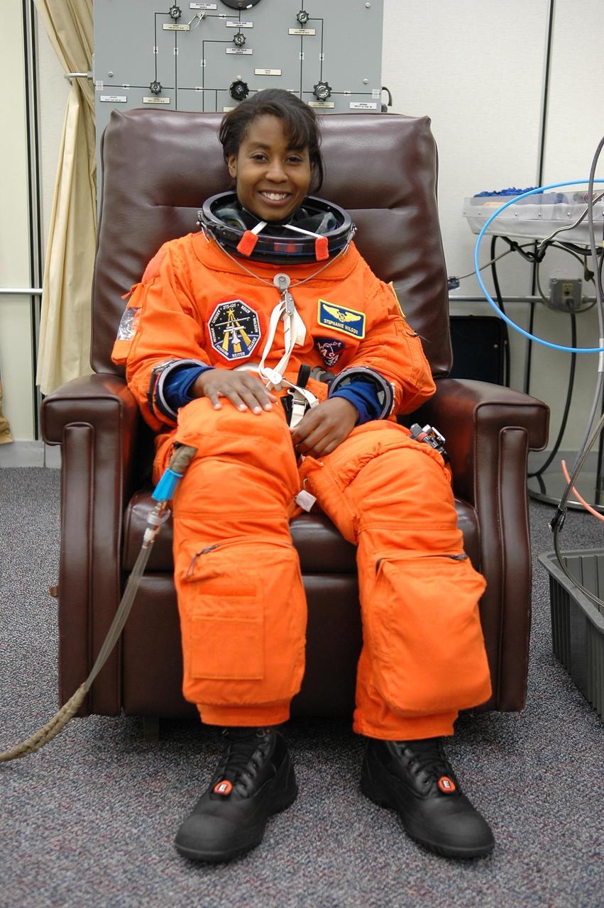 KENNEDY SPACE CENTER, FLA. -  For the second time in two days, STS-121 Mission Specialist Stephanie Wilson is suiting up for a launch attempt on Space Shuttle Discovery.  The first launch attempt July 1 was scrubbed due to weather concerns and postponed 24 hours.    The launch is the 115th shuttle flight and the 18th U.S. flight to the International Space Station.  During the 12-day mission, the STS-121 crew will test new equipment and procedures to improve shuttle safety, as well as deliver supplies and make repairs to the International Space Station. Photo credit: NASA/Kim Shiflett