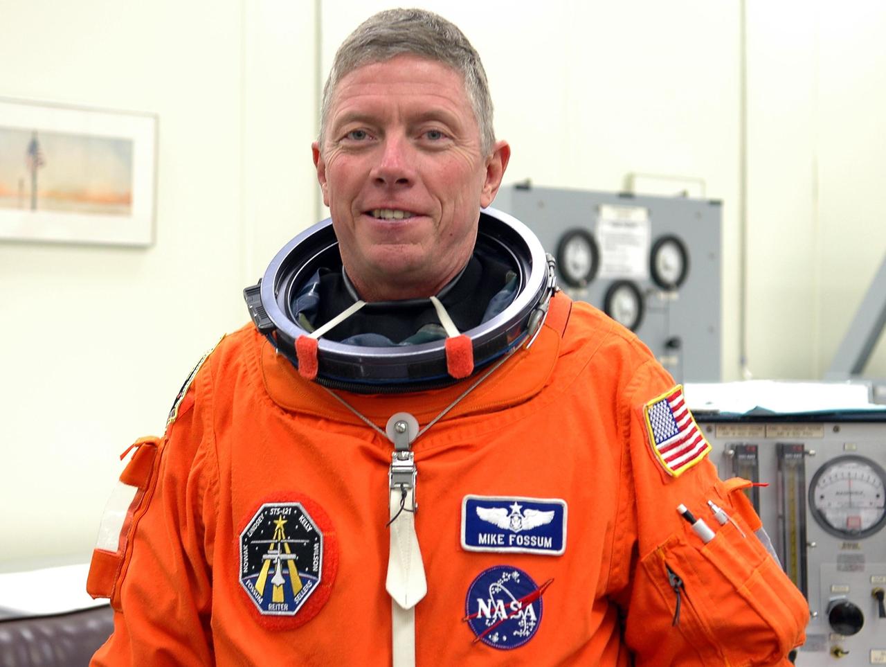KENNEDY SPACE CENTER, FLA. -  STS-121 Mission Specialist Michael Fossum has suited up for a second launch attempt on Space Shuttle Discovery.  The first launch attempt July 1 was scrubbed due to weather concerns and postponed 24 hours.    The launch is the 115th shuttle flight and the 18th U.S. flight to the International Space Station.  During the 12-day mission, the STS-121 crew will test new equipment and procedures to improve shuttle safety, as well as deliver supplies and make repairs to the International Space Station. Photo credit: NASA/Kim Shiflett