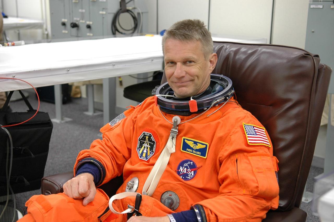 KENNEDY SPACE CENTER, FLA. -  STS-121 Mission Specialist Piers Sellers is suiting up for a second launch attempt on Space Shuttle Discovery.  The first launch attempt July 1 was scrubbed due to weather concerns and postponed 24 hours.  The launch is the 115th shuttle flight and the 18th U.S. flight to the International Space Station.  During the 12-day mission, the STS-121 crew will test new equipment and procedures to improve shuttle safety, as well as deliver supplies and make repairs to the International Space Station. Photo credit: NASA/Kim Shiflett
