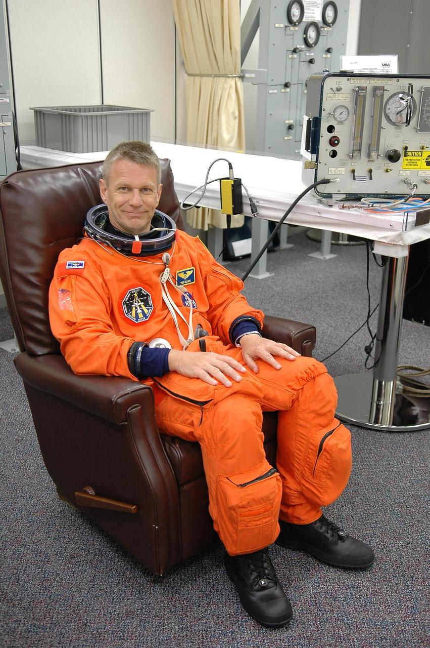 KENNEDY SPACE CENTER, FLA. -  STS-121 Mission Specialist Piers Sellers finishes suiting up for a second launch attempt on Space Shuttle Discovery.  The first launch attempt July 1 was scrubbed due to weather concerns and postponed 24 hours.   The launch is the 115th shuttle flight and the 18th U.S. flight to the International Space Station.  During the 12-day mission, the STS-121 crew will test new equipment and procedures to improve shuttle safety, as well as deliver supplies and make repairs to the International Space Station. Photo credit: NASA/Kim Shiflett
