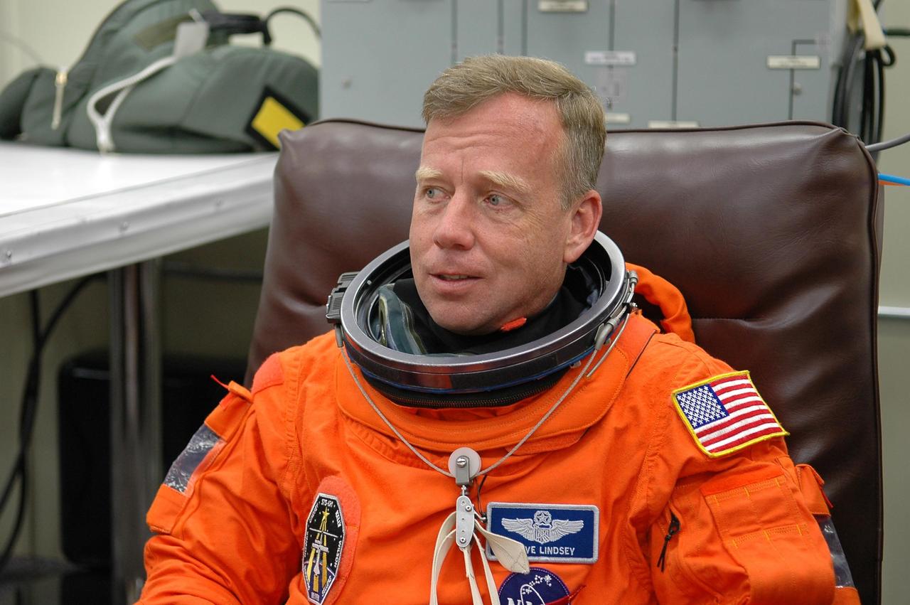 KENNEDY SPACE CENTER, FLA. -  STS-121 Commander Steven Lindsey is suiting up for a second launch attempt on Space Shuttle Discovery.  The first launch attempt July 1 was scrubbed due to weather concerns and postponed 24 hours.  The launch is the 115th shuttle flight and the 18th U.S. flight to the International Space Station.  During the 12-day mission, the STS-121 crew will test new equipment and procedures to improve shuttle safety, as well as deliver supplies and make repairs to the International Space Station. Photo credit: NASA/Kim Shiflett