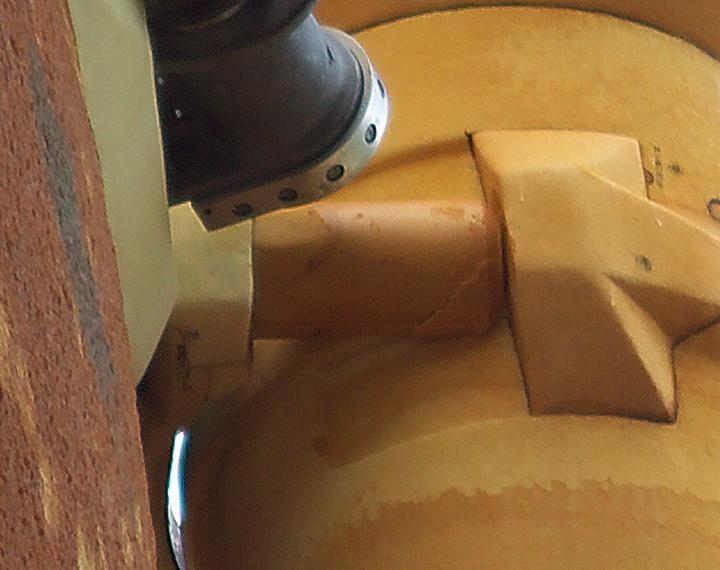 KENNEDY SPACE CENTER, FLA. - A crack formed on a piece of insulation on a strut that attaches the liquid oxygen feedline to External Tank-119, being used to launch space shuttle mission STS-121. This piece of foam, weighing approximately 0.0057 pounds, is three inches long and one-eighth to one-quarter inch wide.  It fell from the tank and was recovered by the Ice Team from the mobile launch platform at Pad 39B.  It is believed that the rain experienced during yesterday’s launch attempt of Discovery caused water to run down the feedline and form ice near the strut next to the feedline bracket.  As the tank warmed and expanded, the ice that formed most likely pinched the foam on the top of the strut, causing a crack and eventual loss of the small piece of foam. Photo credit: NASA