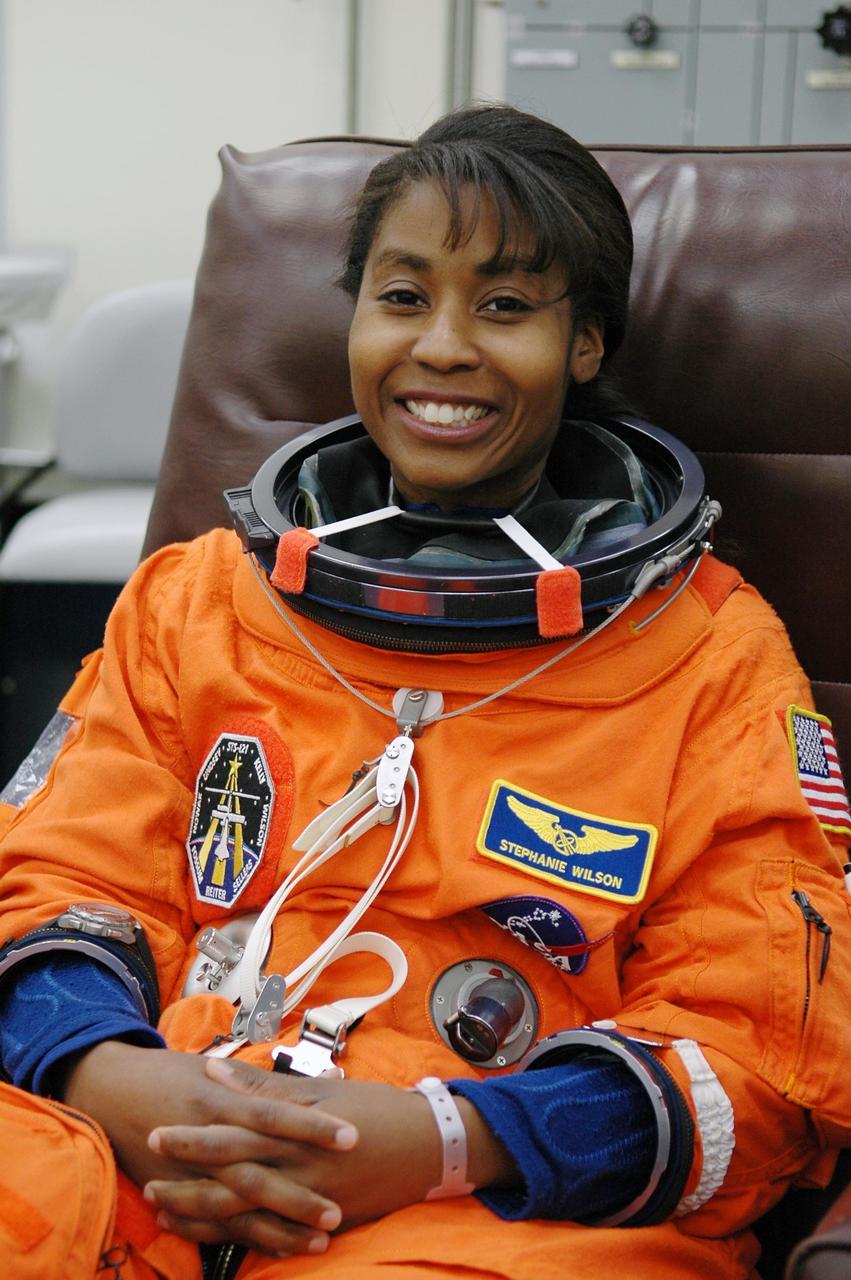 KENNEDY SPACE CENTER, FLA. - Getting ready for a third launch attempt on mission STS-121, Mission Specialist Stephanie Wilson is suiting up before heading to Launch Pad 39B. The July 2 launch attempt was scrubbed due to the presence of showers and thunderstorms within the surrounding area of the launch site. The launch of Space Shuttle Discovery on mission STS-121 is the 115th shuttle flight and the 18th U.S. flight to the International Space Station. During the 12-day mission, the STS-121 crew will test new equipment and procedures to improve shuttle safety, as well as deliver supplies and make repairs to the International Space Station. Photo credit: NASA/Kim Shiflett