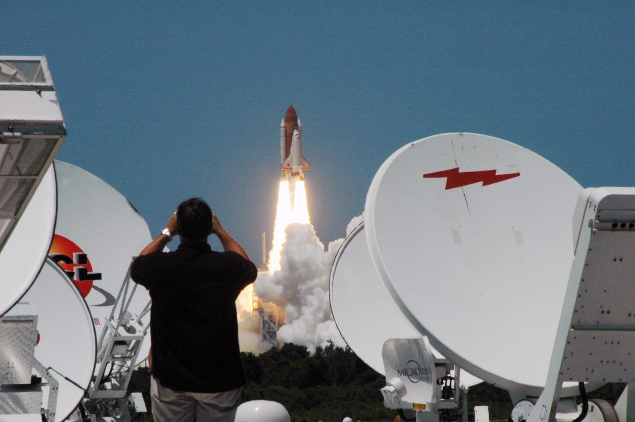 KENNEDY SPACE CENTER, FLA. - Under clear blue skies, the launch of Space Shuttle Discovery on mission STS-121 kicks off the fireworks for the U.S. holiday in its third launch attempt in four days. Liftoff was on-time at 2:38 p.m. EDT. During the 12-day mission, the STS-121 crew of seven will test new equipment and procedures to improve shuttle safety, as well as deliver supplies and make repairs to the International Space Station. Landing is scheduled for July 16 or 17 at Kennedy's Shuttle Landing Facility. Photo credit: NASA/Ken Thornsley