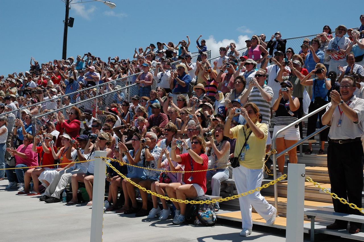 KENNEDY SPACE CENTER, FLA. - Cameras are the accessory of the day at the Kennedy Space Center's Banana River viewing site. All eyes and lenses are focused on Launch Pad 39B and the successful launch of Space Shuttle Discovery on mission STS-121. It was the third launch attempt in four days; the others were scrubbed due to weather concerns. Liftoff was on-time at 2:38 p.m. EDT. During the 12-day mission, the STS-121 crew of seven will test new equipment and procedures to improve shuttle safety, as well as deliver supplies and make repairs to the International Space Station. Landing is scheduled for July 16 or 17 at Kennedy's Shuttle Landing Facility. Photo credit: NASA/Louie Roguevert